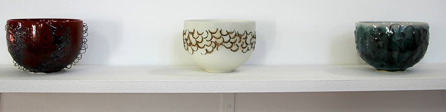Ceramic bowls on a shelf